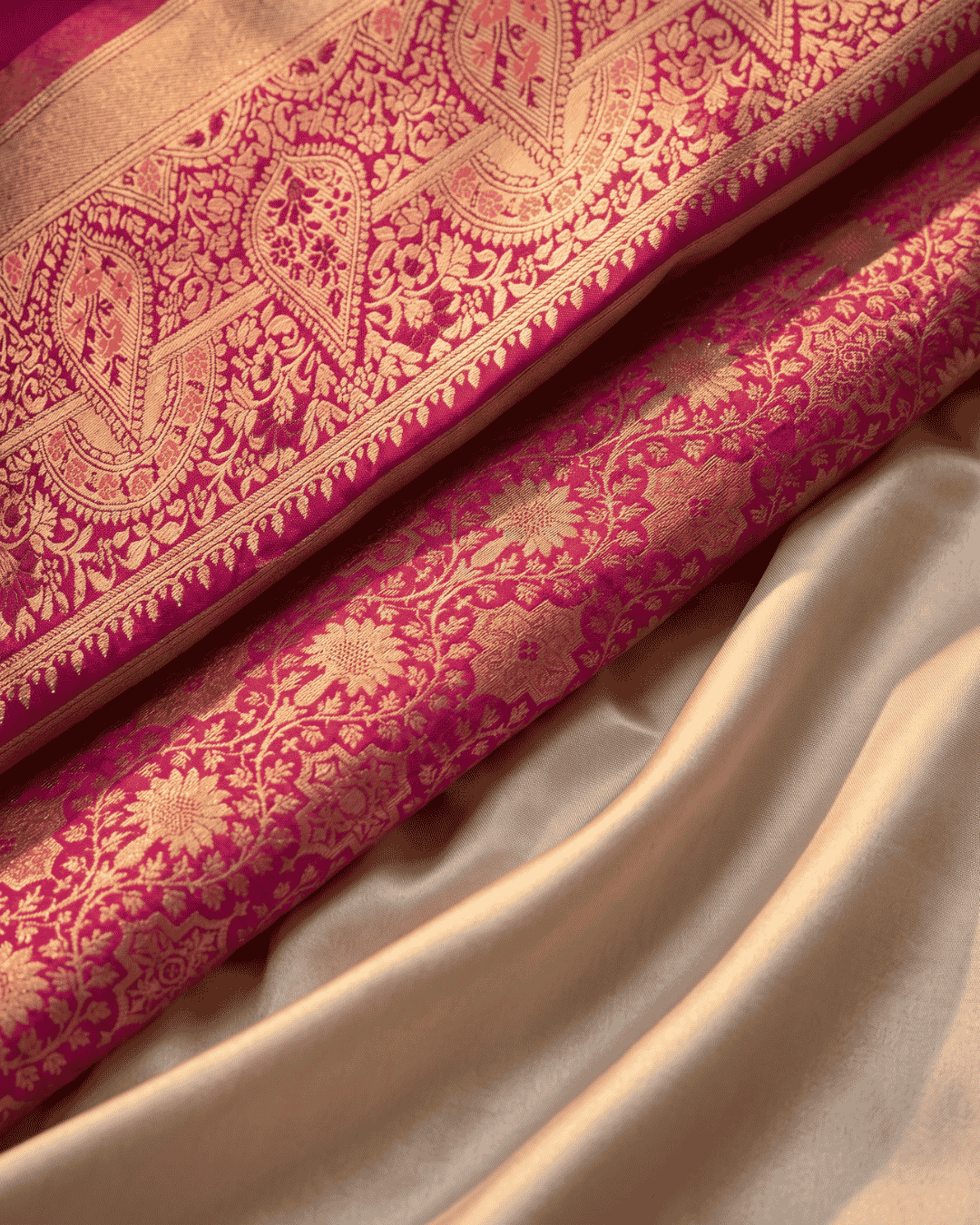 Close-up of the golden zari floral details of the beige and pink ready to wear pocket saree