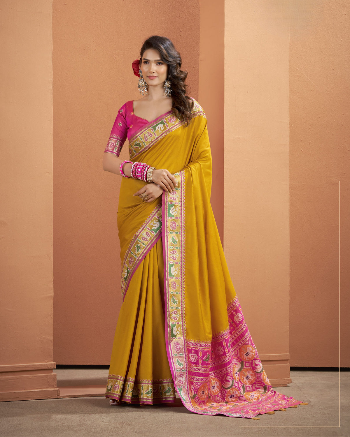 Mustard yellow Patola Silk ready-to-wear pocket saree with pink and green patterned border