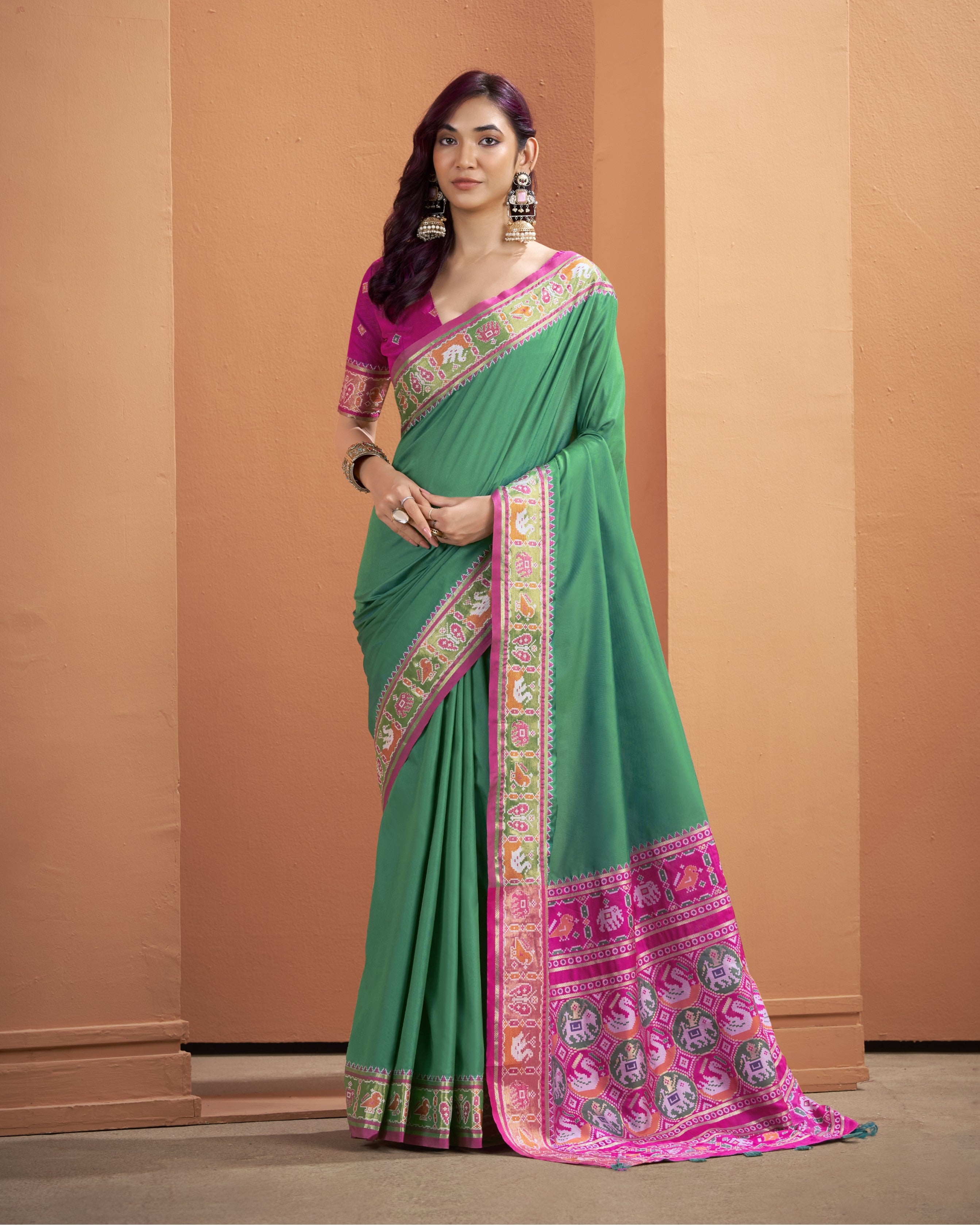Green Patola silk ready-to-wear pocket saree with a vibrant magenta patterned pallu