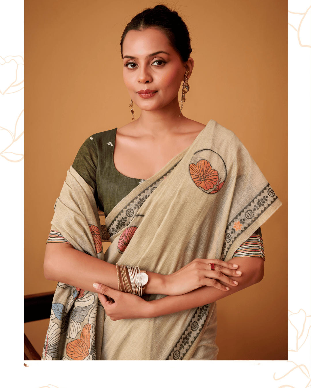 Waist-up front shot of the model wearing the Petal Vines pre-draped pocket saree, highlighting the charcoal patterned border with floral accents.