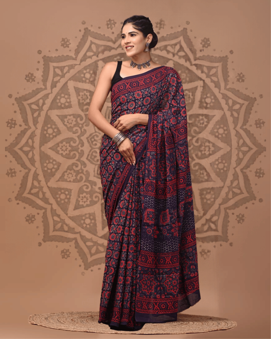 Dark navy-plum Mul Cotton ready-to-wear pocket saree featuring red medallions, geometric motifs, patterned borders and an intricately printed pallu.