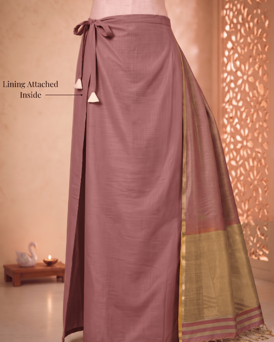 Attached lining and drawstring closure of the luminous glow tissue silk ready to wear pocket saree in rose.