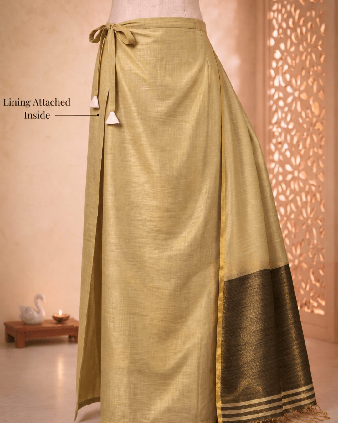 Attached lining and drawstring closure of the Luminous Glow Tissue Silk Ready To Wear Pocket Saree in gold.