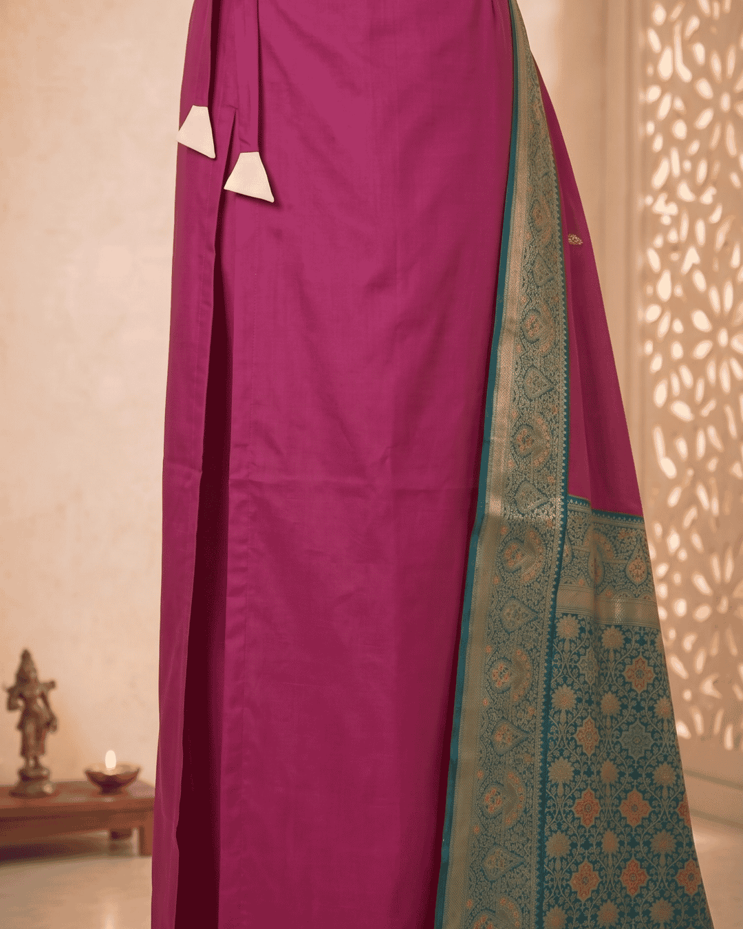 Attached lining of the soft silk ready to wear pocket saree in a wine shade