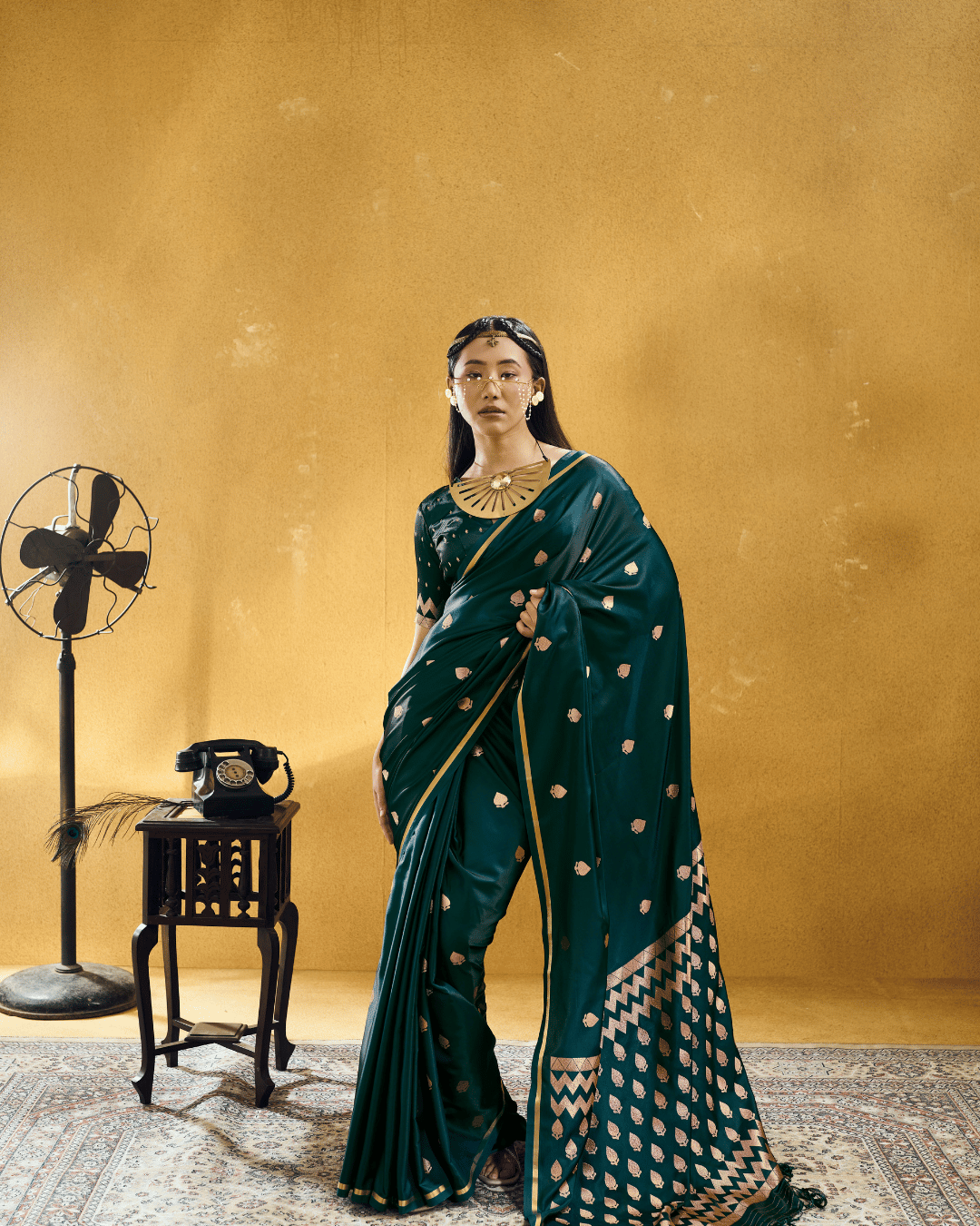 Full-length front shot of the model wearing the Forest Green Chevron powerloom silk ready-to-wear pocket saree, featuring pre-stitched pleats, metallic gold border piping, and a flowing chevron-patterned pallu.