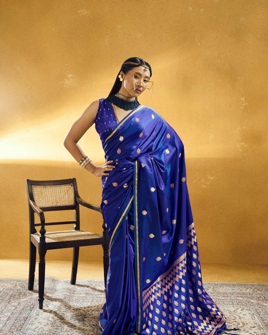 Full-length standing shot of the model wearing the Royal Blue Chevron powerloom silk ready-to-wear pocket saree, featuring pre-stitched pleats, metallic gold piping, scattered gold leaf motifs, and a structured chevron-patterned pallu.
