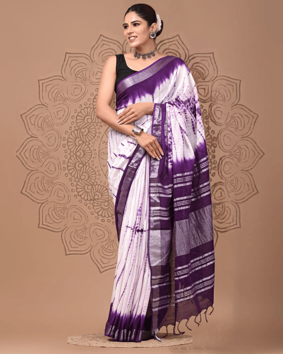 Elara linen ready-to-wear pocket saree in lavender and white with violet tie-dye detailing, striped pallu, deep purple border and tassel finish.