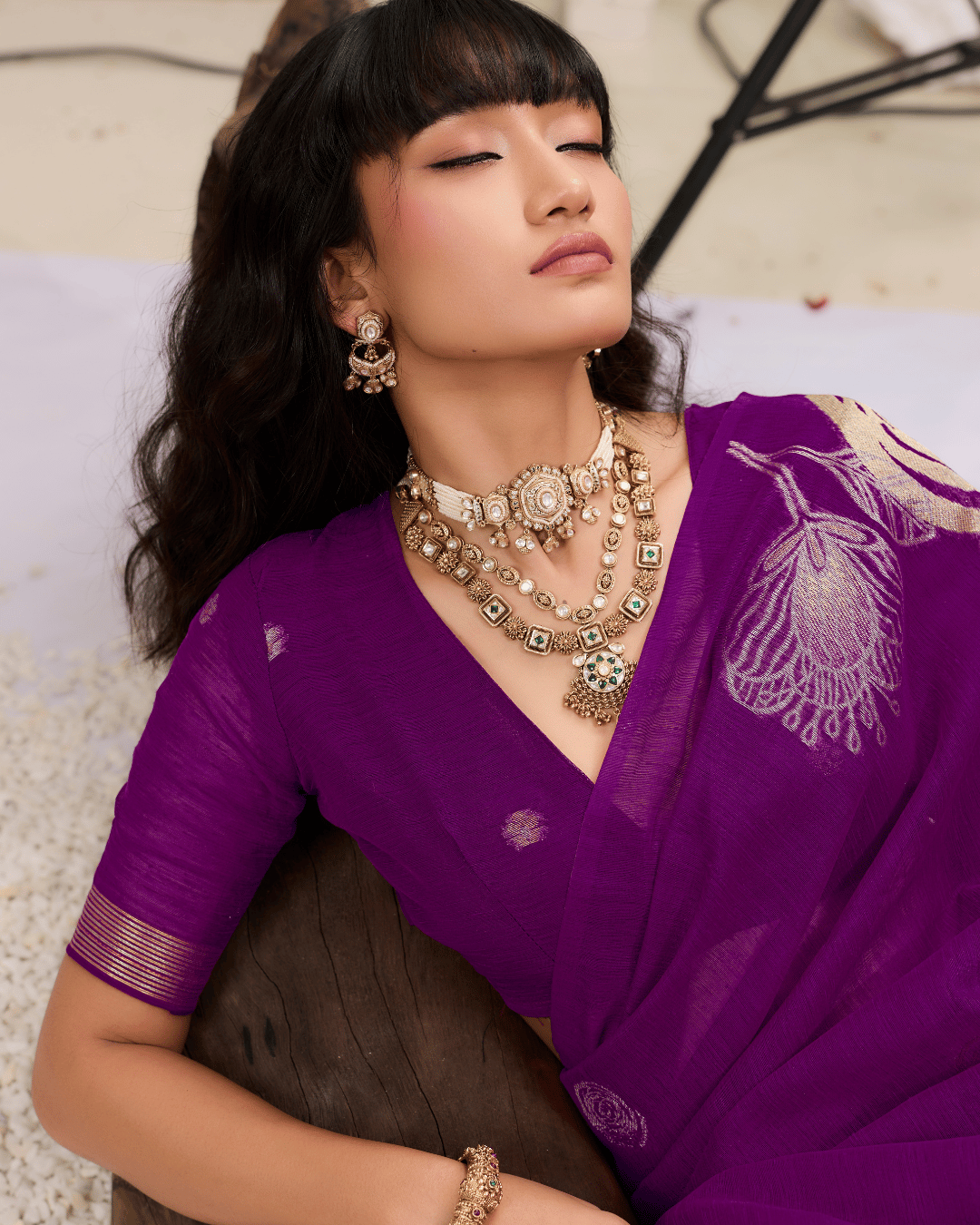 Top-angle close-up portrait of the fine munga-silk surface texture and floral details.
