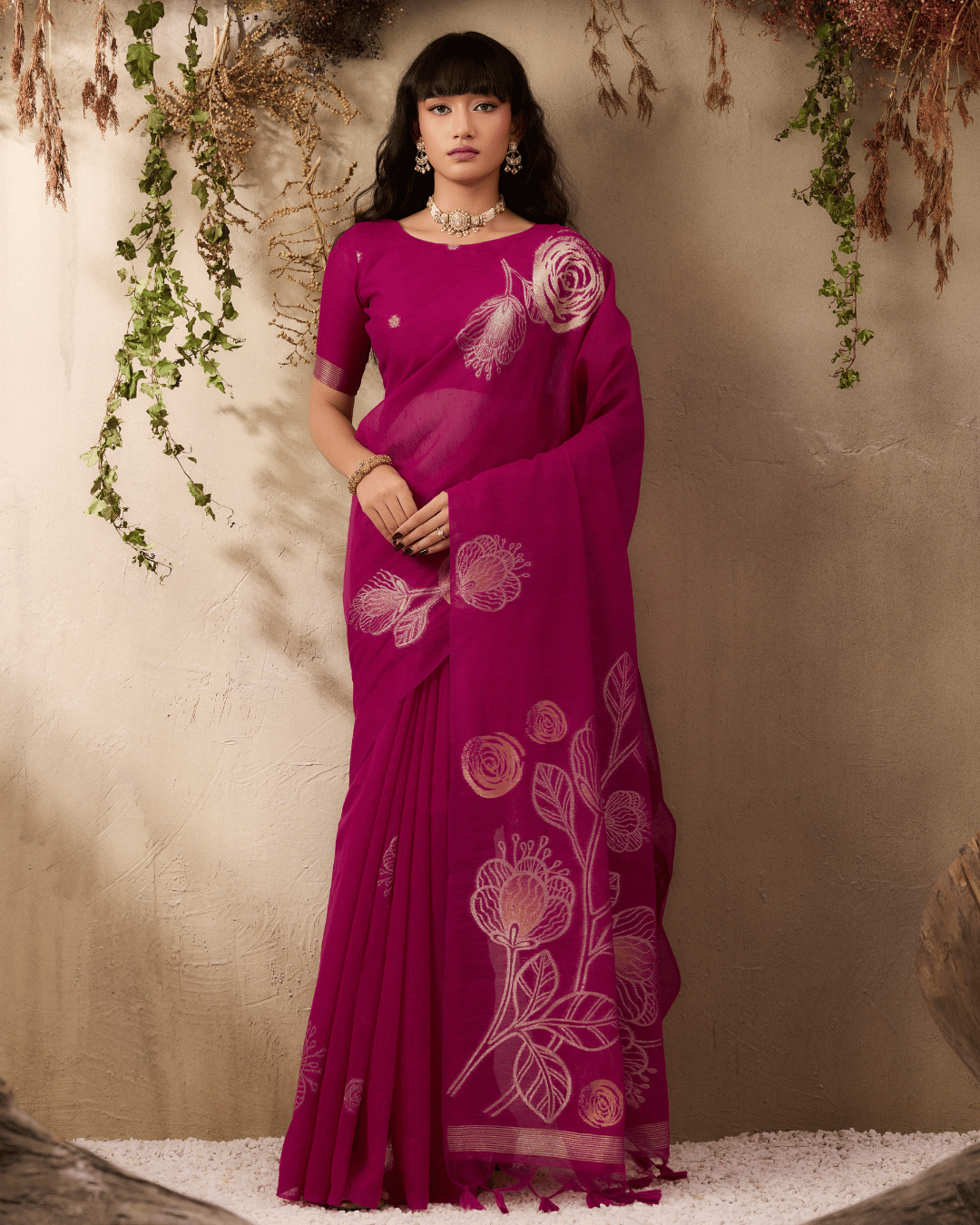 Front portrait showcasing the elegant fall of the pre-draped magenta silk ready to wear pocket saree, highlighting the balance between small scattered circular body motifs and oversized pallu artwork.