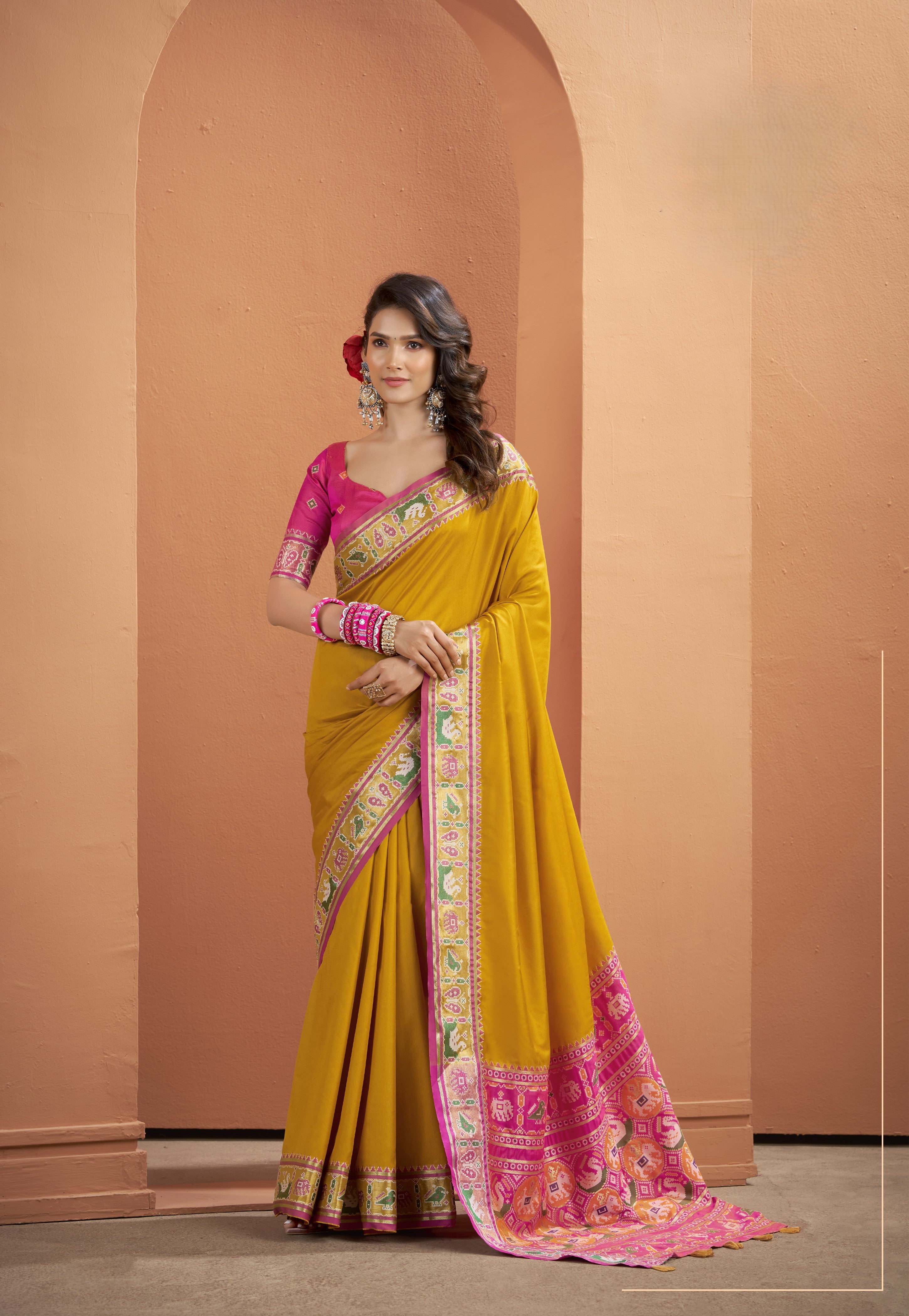 Mustard yellow Patola Silk ready-to-wear pocket saree with pink and green patterned border
