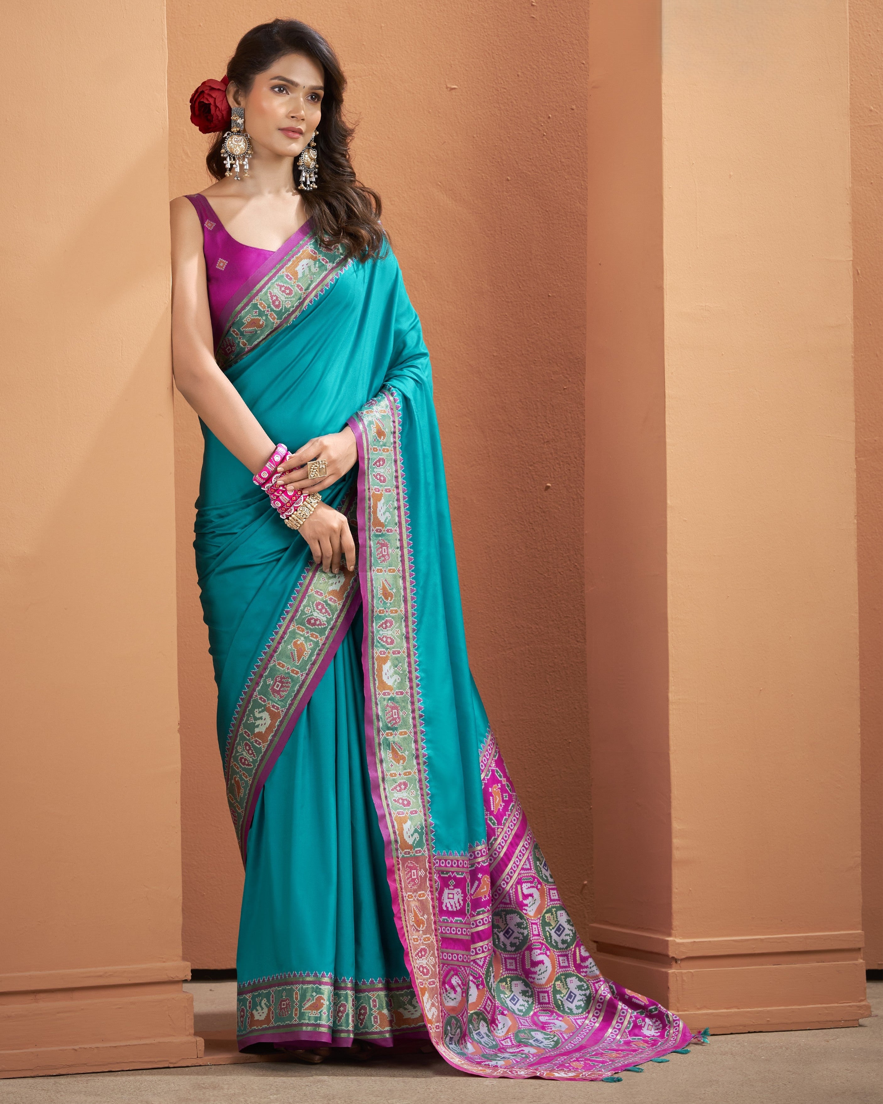 Teal blue ready-to-wear pocket saree with a vibrant pink border.