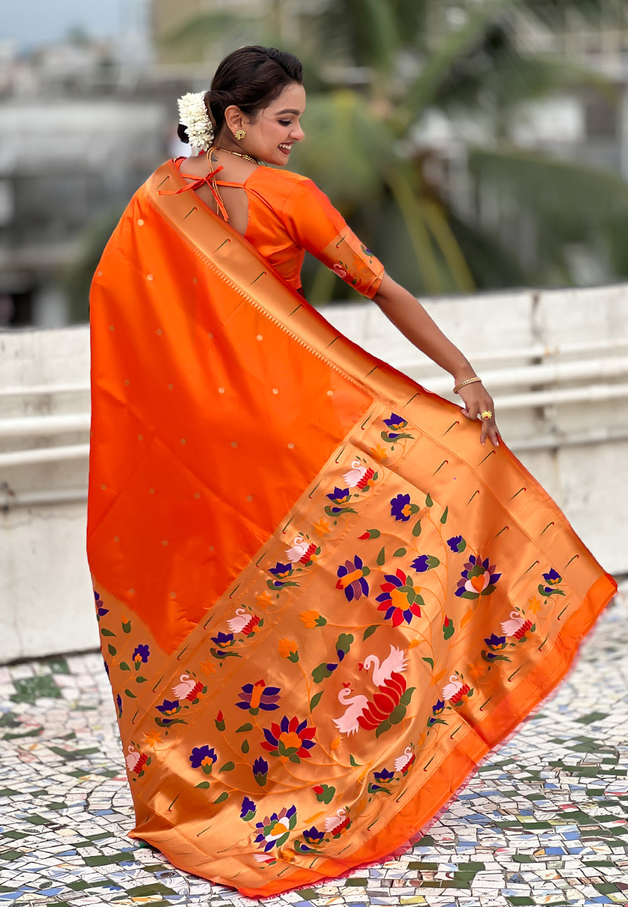 Back view of a golden-peach floral pallu on an orange ready-to-wear pocket saree.
