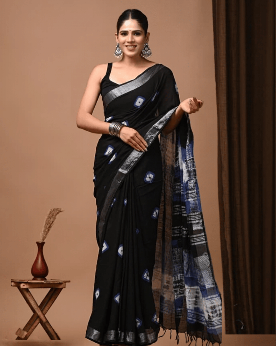 Midnight Mosaic Ready to wear pocket saree. Elegant black saree with blue geometric patterns and a silver-blue border 