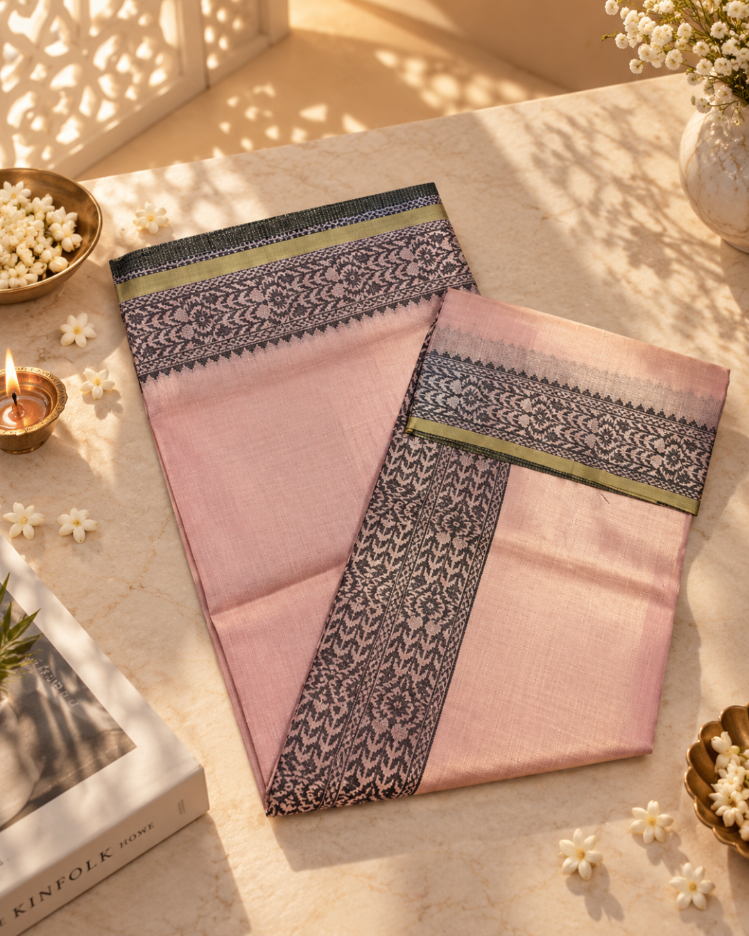 Overhead flat lay view of the folded peach Meher Tissue Linen ready-to-wear pocket saree, displaying its deep charcoal patterned pallu, geometric border, and slim muted mustard accent stripe.