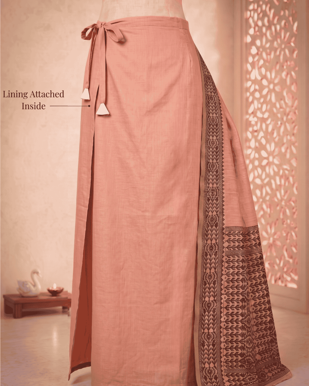 Detailed view of the meher peach pre-stitched pocket saree's waist structure showing the built-in lining and the adjustable waist drawstring.