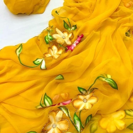 Closeup of the floral detailing and chiffon fabric of the fresh floral grace pre-draped saree with pocket.