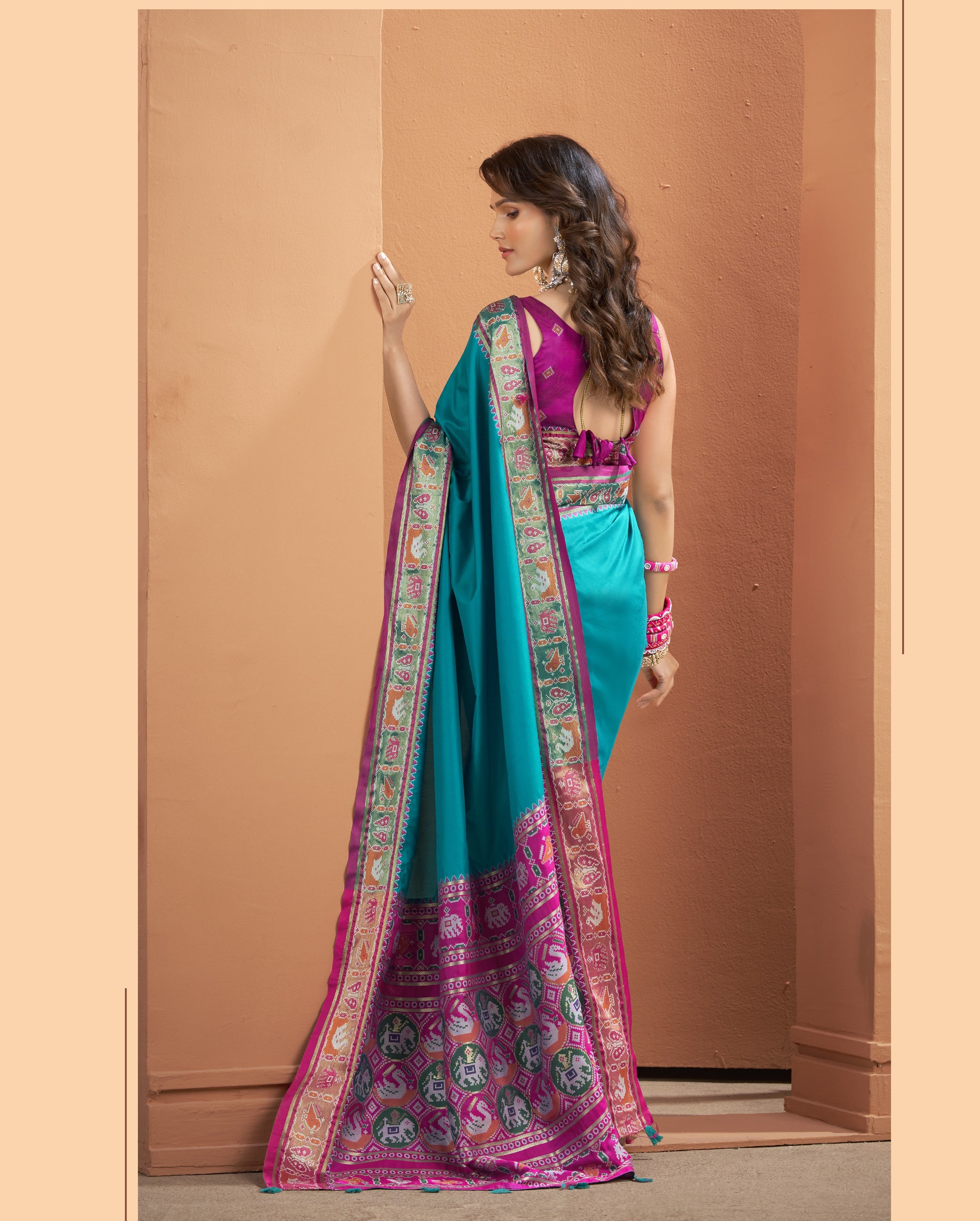 Back shot of the teal blue ready-to-wear pocket saree showing the details on the pallu and the border