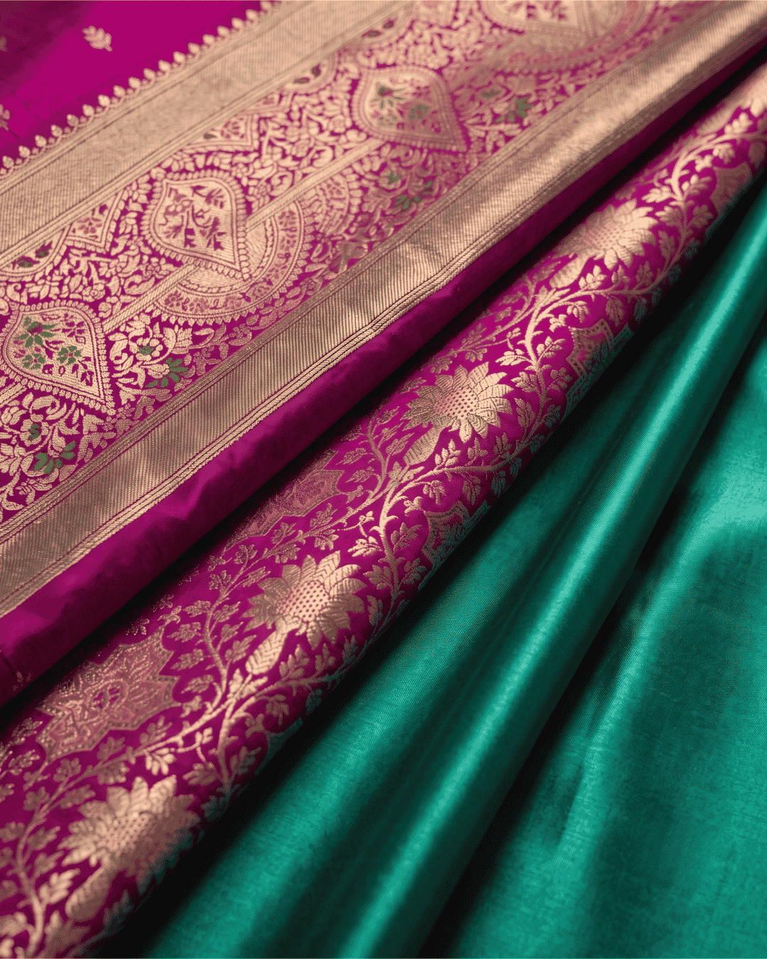 Close-up of teal green and magenta Soft Silk ready to wear pocket saree with intricate floral zari